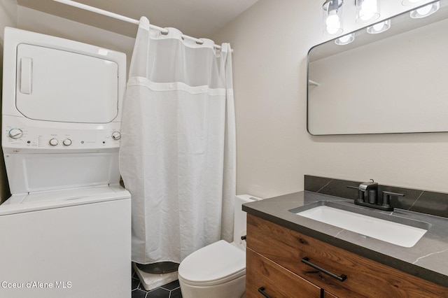 762 Reeder Bay Rd, Nordman, ID 83848 - full bath featuring stacked washer and clothes dryer, toilet, and vanity
