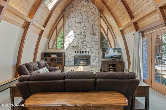 762 Reeder Bay Rd, Nordman, ID 83848 - living room with wooden ceiling, carpet, beamed ceiling, plenty of natural light, and a stone fireplace