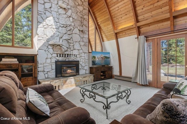 762 Reeder Bay Rd, Nordman, ID 83848 - living area featuring wooden ceiling, plenty of natural light, beamed ceiling, carpet, and baseboard heating