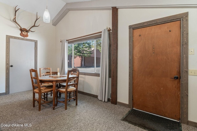 762 Reeder Bay Rd, Nordman, ID 83848 - dining area with carpet floors and lofted ceiling