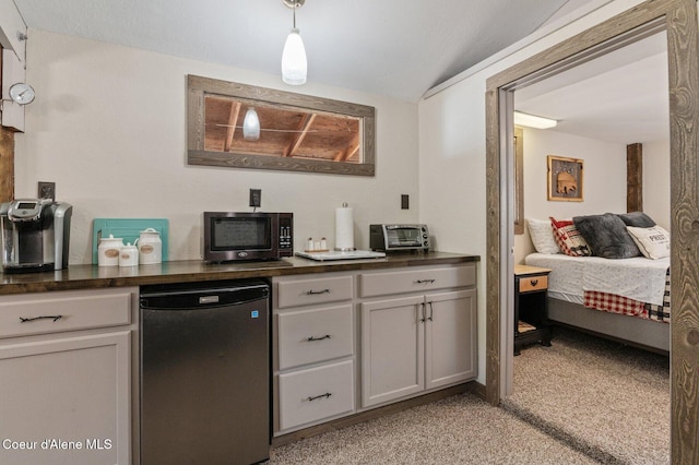 762 Reeder Bay Rd, Nordman, ID 83848 - kitchen featuring dark countertops, light carpet, fridge, dishwasher, and hanging light fixtures