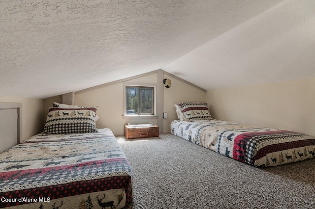 762 Reeder Bay Rd, Nordman, ID 83848 - bedroom featuring carpet floors and vaulted ceiling