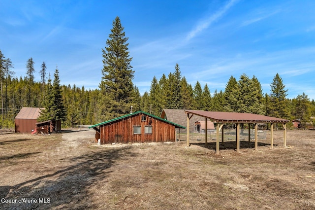 762 Reeder Bay Rd, Nordman, ID 83848 - rear view of house with a forest view