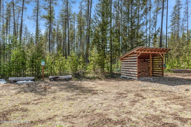 762 Reeder Bay Rd, Nordman, ID 83848 - view of yard with an outbuilding and a wooded view