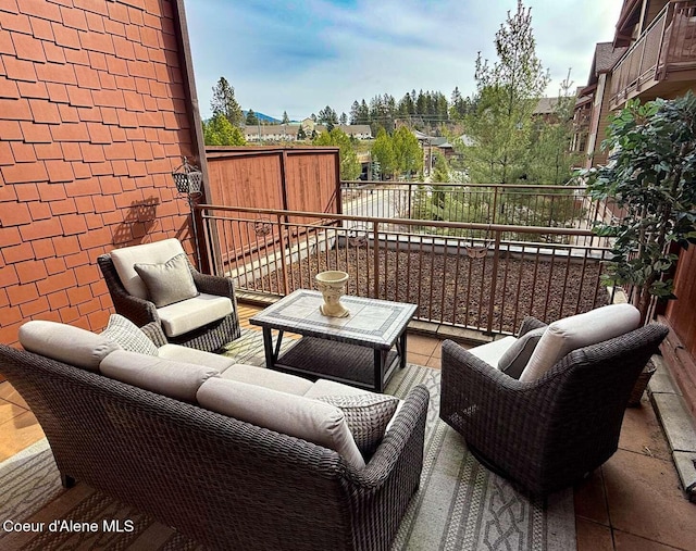 2051 N Main St # 217, Coeur Dalene, ID 83814 - view of patio featuring a balcony and outdoor lounge area