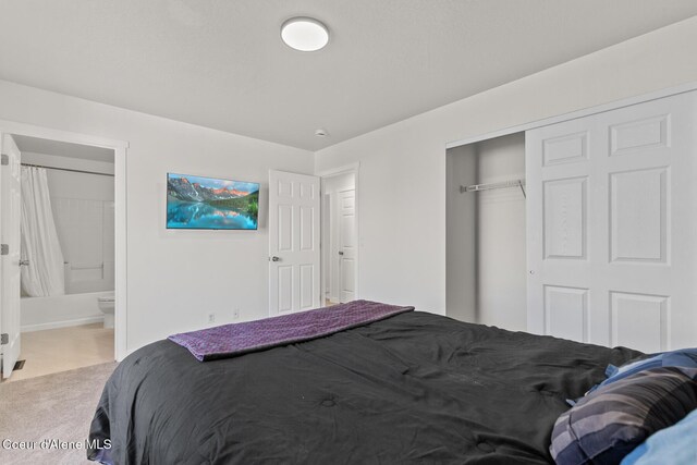 4905 W Lemonwood Ln, Post Falls, ID 83854 - bedroom with carpet floors, a closet, and connected bathroom