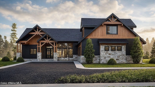 215 White Cloud Dr, Sandpoint, ID 83864 - view of front of house featuring stone siding and a shingled roof
