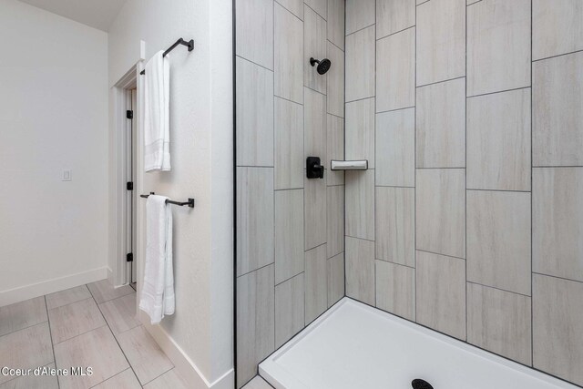 215 White Cloud Dr, Sandpoint, ID 83864 - bathroom with tiled shower and baseboards
