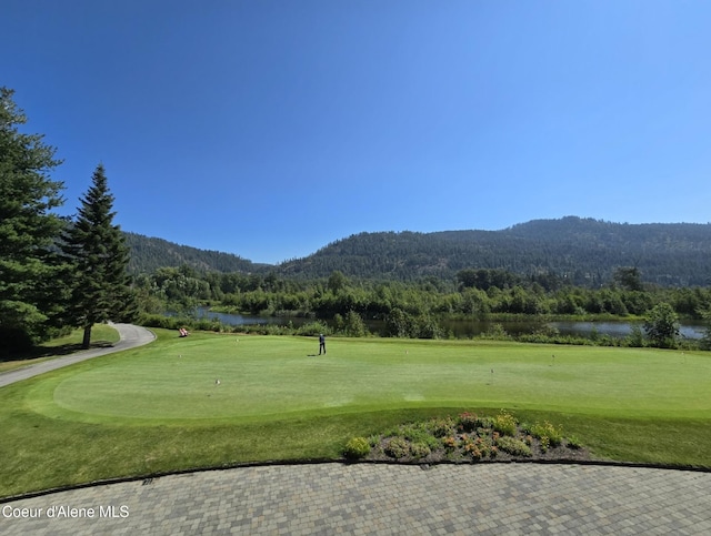 215 White Cloud Dr, Sandpoint, ID 83864 - view of property's community featuring a view of trees, a water and mountain view, view of golf course, and a yard