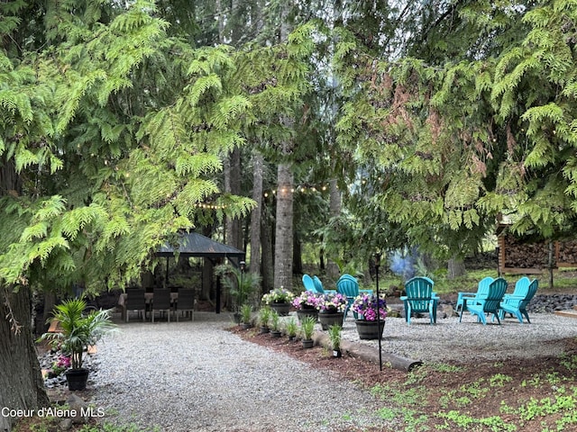 15818 N Morgan Ln, Hayden, ID 83835 - surrounding community with a patio, a gazebo, and outdoor dining space