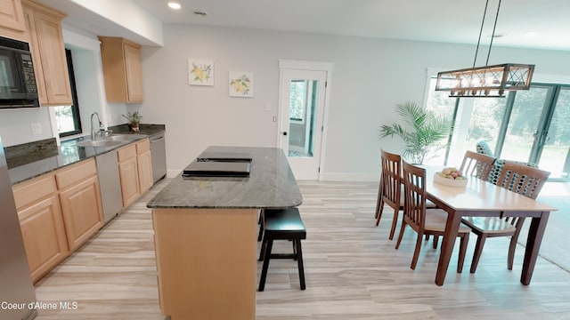 15818 N Morgan Ln, Hayden, ID 83835 - kitchen featuring light brown cabinetry, a sink, a center island, black microwave, and recessed lighting