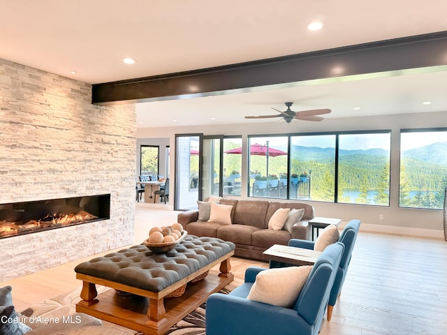 15818 N Morgan Ln, Hayden, ID 83835 - living area with a fireplace, wood finished floors, recessed lighting, ceiling fan, and baseboards
