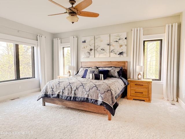 15818 N Morgan Ln, Hayden, ID 83835 - carpeted bedroom featuring baseboards and ceiling fan