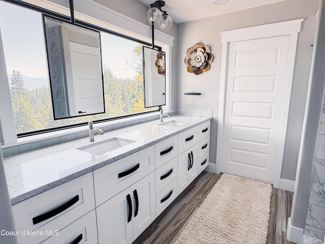 15818 N Morgan Ln, Hayden, ID 83835 - full bath with wood finished floors, double vanity, and plenty of natural light