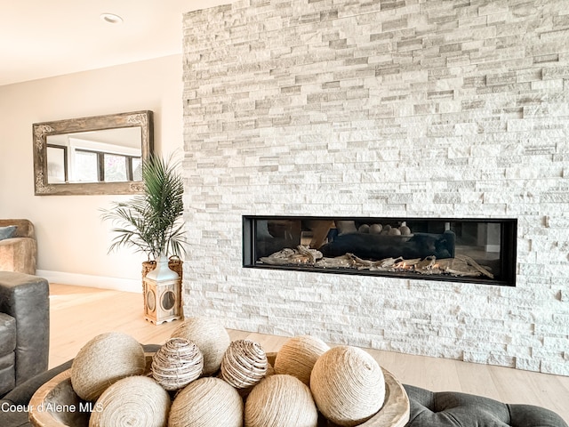 15818 N Morgan Ln, Hayden, ID 83835 - living area with a fireplace, baseboards, and wood finished floors