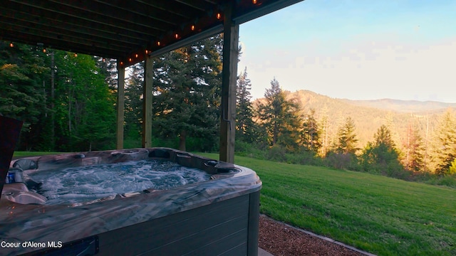 15818 N Morgan Ln, Hayden, ID 83835 - exterior view of a jacuzzi, a view of trees, and a mountain view