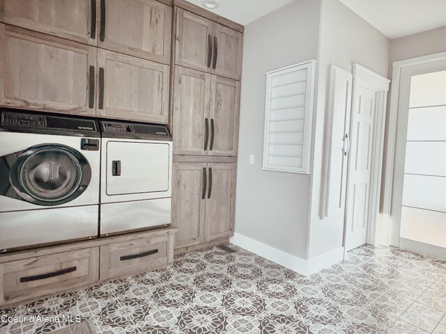 15818 N Morgan Ln, Hayden, ID 83835 - laundry room with cabinet space, washer and dryer, and baseboards