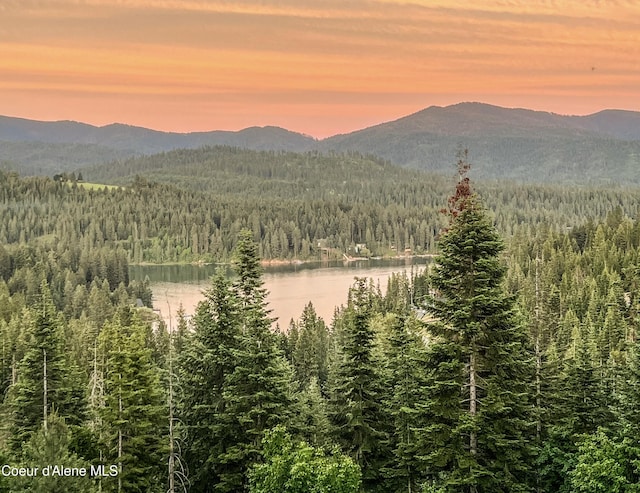 15818 N Morgan Ln, Hayden, ID 83835 - mountain view with a heavily wooded area and a nearby body of water