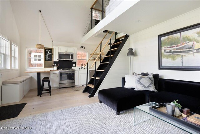 232 Pomrankey Ln, Dover, ID 83825 - living area with stairway, light wood finished floors, and a high ceiling