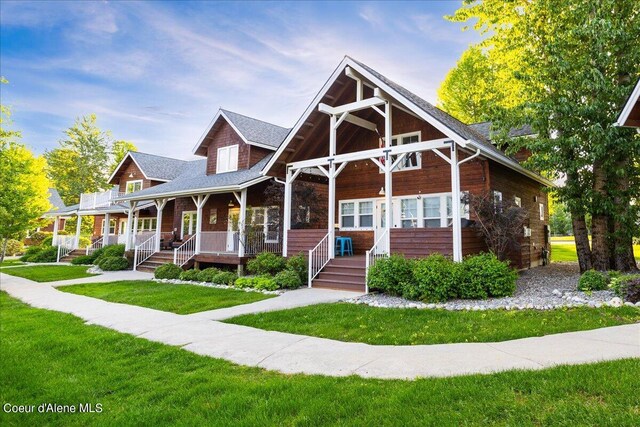 232 Pomrankey Ln, Dover, ID 83825 - view of front facade with covered porch and a front lawn