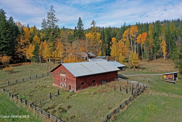 847 Willford Rd, Cocolalla, ID 83813 - view of outdoor structure featuring a forest view, an outdoor structure, and a rural view