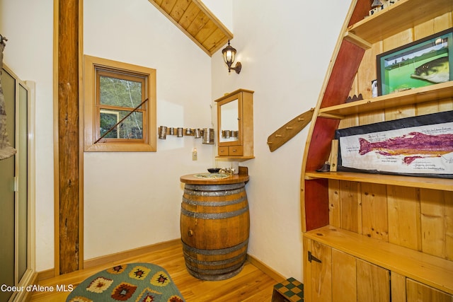 847 Willford Rd, Cocolalla, ID 83813 - hallway featuring wood finished floors, lofted ceiling, and baseboards