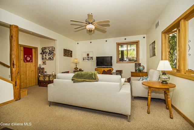847 Willford Rd, Cocolalla, ID 83813 - living room featuring light carpet, a ceiling fan, and stairs