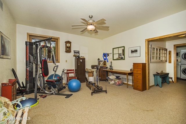 847 Willford Rd, Cocolalla, ID 83813 - exercise room with stacked washer / drying machine, a ceiling fan, and carpet floors