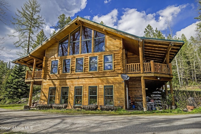 847 Willford Rd, Cocolalla, ID 83813 - view of side of home featuring a balcony and log siding