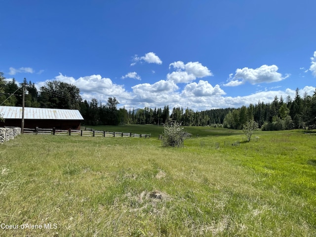 847 Willford Rd, Cocolalla, ID 83813 - view of yard featuring a wooded view, a view of rural / pastoral area, an outbuilding, and a pole building