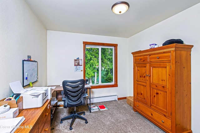 office space featuring a baseboard heating unit, carpet flooring, and baseboards