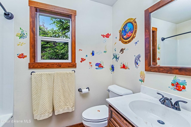 bathroom with toilet and vanity