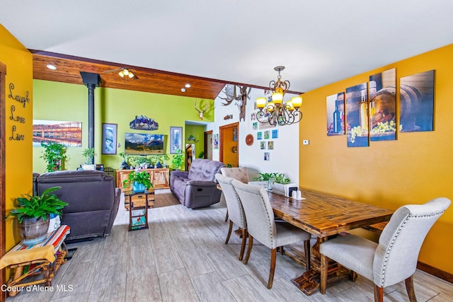 dining room featuring a chandelier and wood finished floors