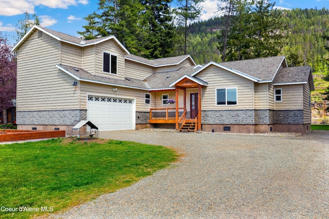 view of front facade with driveway, a garage, stone siding, crawl space, and a shingled roof
