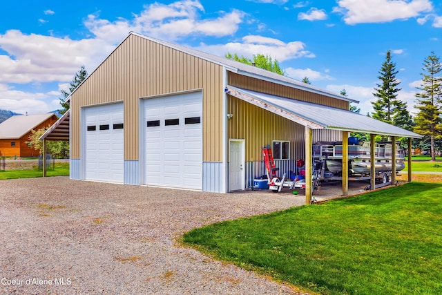 garage with a garage and gravel driveway
