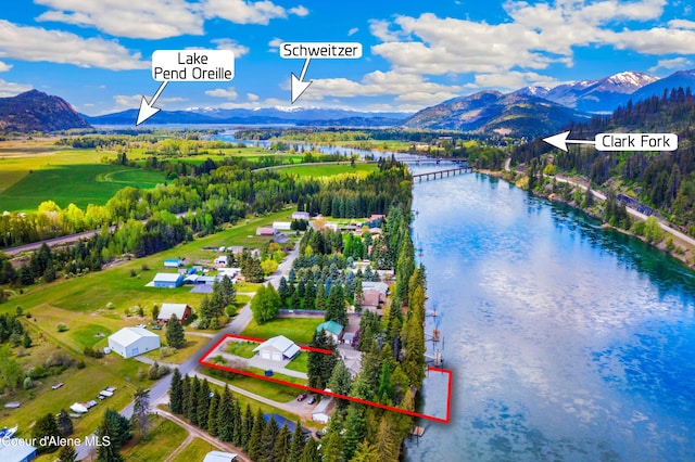 aerial overview of property's location featuring a water and mountain view and property parcel outlined