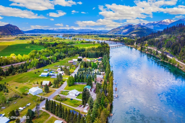drone / aerial view of a water and mountain view