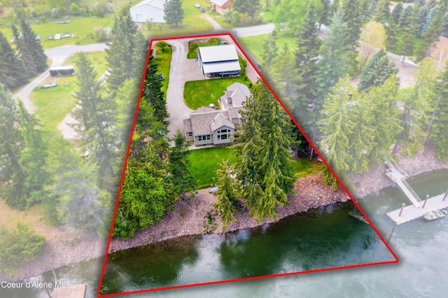aerial view of property and surrounding area with property boundaries highlighted and a nearby body of water