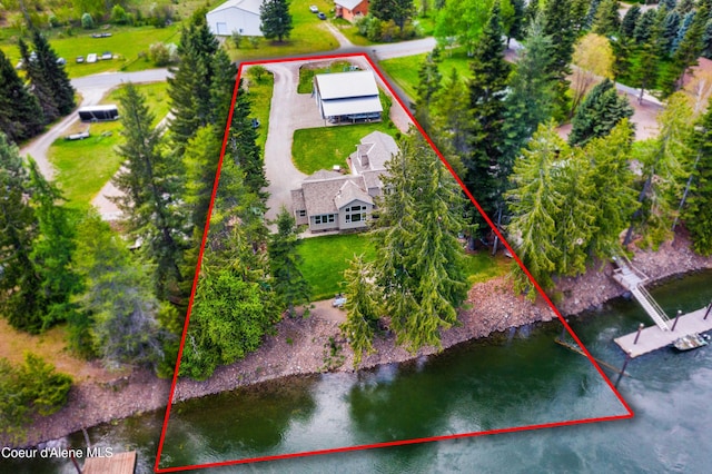 view of subject property featuring property parcel outlined and a nearby body of water
