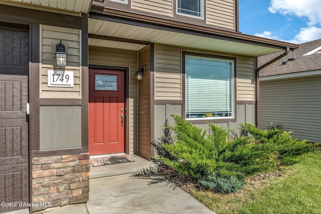1749 N Minam Loop, Post Falls, ID 83854 - doorway to property featuring covered porch