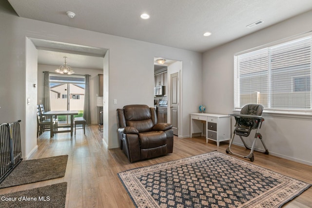 1749 N Minam Loop, Post Falls, ID 83854 - office area with a chandelier, light wood-style floors, baseboards, and recessed lighting