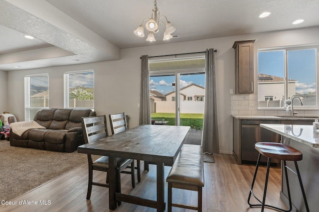1749 N Minam Loop, Post Falls, ID 83854 - dining space with a chandelier, light wood-style flooring, and recessed lighting