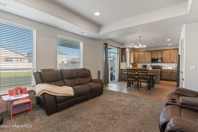 1749 N Minam Loop, Post Falls, ID 83854 - living room with a chandelier, recessed lighting, and wood finished floors