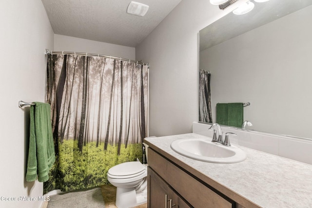 1749 N Minam Loop, Post Falls, ID 83854 - full bathroom featuring vanity, toilet, a shower with curtain, and a textured ceiling