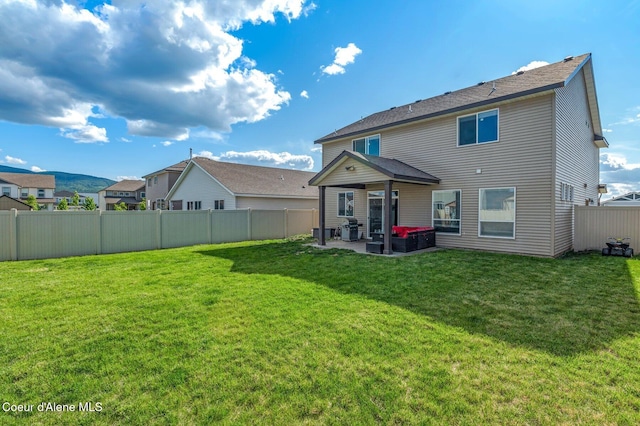 1749 N Minam Loop, Post Falls, ID 83854 - back of house featuring a patio area and a shingled roof