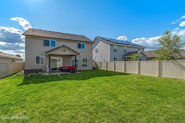 1749 N Minam Loop, Post Falls, ID 83854 - rear view of house with a patio