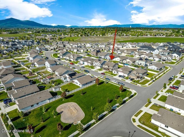 1749 N Minam Loop, Post Falls, ID 83854 - aerial overview of property's location featuring a mountainous background and nearby suburban area