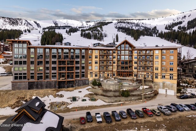 124 Village Ln Unit 108, Sandpoint, ID 83864 - snow covered building featuring a mountain view