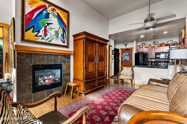 124 Village Ln Unit 108, Sandpoint, ID 83864 - living area featuring wood finished floors, a fireplace, and a ceiling fan