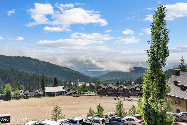 124 Village Ln Unit 108, Sandpoint, ID 83864 - mountain view featuring a heavily wooded area